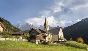 The church Sankt Magdalena in the Villnoess valley in the Dolomites during autumn