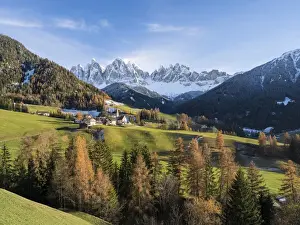 The church Sankt Magdalena in the Villnoess valley in the Dolomites during autumn