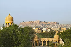 Cityscape of traditional architecture, Jasailmer Fort in the distance, Jaisalmer