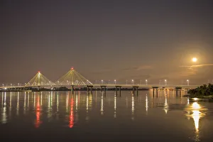 Clark Bridge at night over Mississippi River and full moon, Alton, Illinois