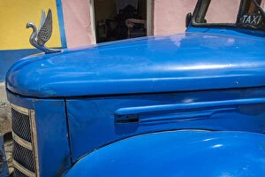 Detail of classic blue American car with chrome swan hood ornament in Trinidad, Cuba