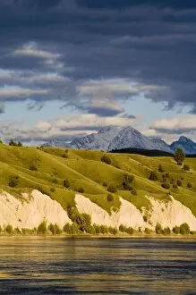 Images Dated 5th May 2007: Clay Cliffs reflect into the Flathead River with Mission mountains in the background