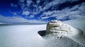 Gypsum Prints: A clearing in the clouds allows for an ancient yardang to stand out in the middle