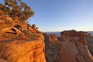 Cliffs of the Colorado National Monument catch mornings first light near Fruita, Colorado