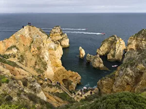 The cliffs and sea stacks of Ponta da Piedade at the rocky coast of the Algarve in Portugal