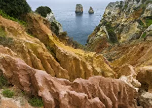 Portugal Collection: The cliffs and sea stacks of Ponta da Piedade at the rocky coast of the Algarve in Portugal