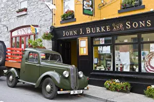 Utility Prints: Clonbur, Ireland. An old truck sits outside John Burkes, a well-known restaurant