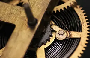 Timepiece Prints: Close Up abstract of internal moving parts of an old watch with brass wheels of an