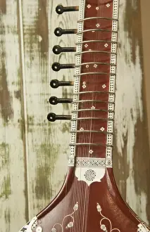 Images Dated 2032: Close up abstract of a wood indian sitar string insturment of music in India