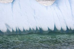 close up of the edge of an iceberg floating off the western Antarctic peninsula, Antarctica