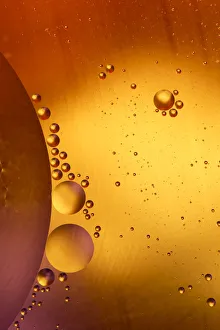 Close-up pattern of bubbles in oil and water mixture