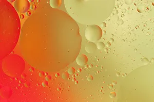 Close-up pattern of bubbles in oil and water mixture