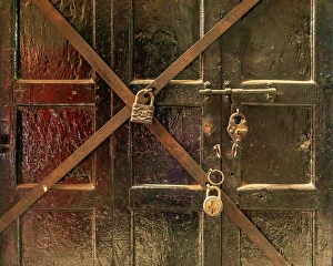 Tool Prints: Close-up of wooden door with multiple padlocks