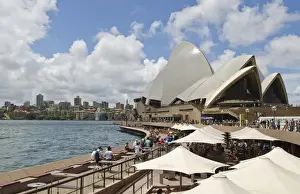 Images Dated 2028: Closeup of restaurant umbrellas and famous Sydney Opera House in harbour in New South