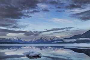 Lake Mcdonald Prints: Clouds reflect in opening in the ice on Lake McDonald in Glacier National Park