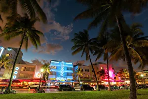 Bicycle Prints: The Colony Hotel and Ocean Drive at dusk. South Beach, Miami Beach, Florida