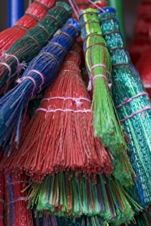 Images Dated 20th October 2004: Colorful Brooms for sale by street vendor, Alexandria Egypt