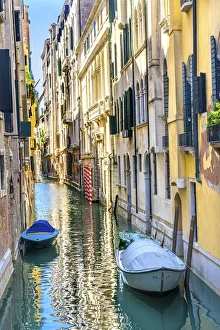 Colorful buildings and poles reflection, Venice, Italy