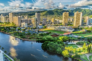 Images Dated 24th January 2024: Colorful canoes, Ala Wai Canal reflection, Honolulu, Oahu, Hawaii