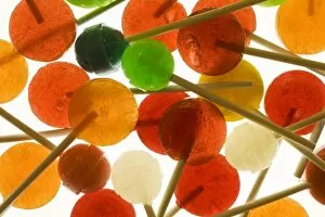Colorful design with variety of lollipop candy on sticks