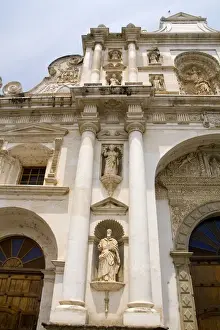 Antigua Prints: Colorful famous main church called Cathedral de Santiago in tourist village of Antigua