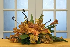 Colorful flower arrangement on table in front of door