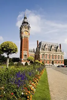 Images Dated 12th August 2020: Colorful flowers in sunshine of beautiful Hotel de Ville architecture in small French