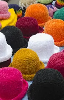 Images Dated 2027: Colorful hats for sale souvenirs in small village of Otavalo Ecuador South America