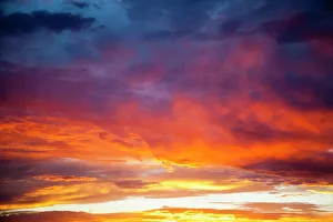 Back Ground Prints: Colorful sunset blossoms across a New Mexico sky