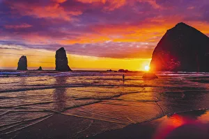 Dancing Prints: Colorful sunset, Haystack Rock sea stacks, Canon Beach, Clatsop County, Oregon