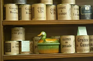 Conserve cans with different kinds of duck specialities Cassoulet de Bergerac, Coq au vin