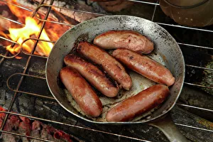 Central Otago Prints: Cooking sausages on a campfire, Central Otago, South Island, New Zealand