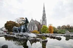Copenhagen, Denmark - An ancient church with a steeple in a rural setting. In