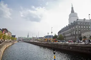 Copenhagen, Denmark - A canal running through an old world city. Horizontal shot