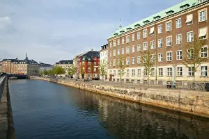 Copenhagen, Denmark - A canal running through an old world city. Horizontal shot