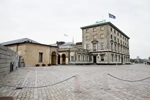 Low Angle Prints: Copenhagen, Denmark - Cobblestone square in front of an old world building. Horizontal