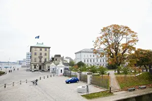Copenhagen, Denmark - Cobblestone square in front of an old world building next to a city park