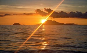 Volcanic Prints: Coral Sea, Papua New Guinea. Landscape view across the ocean of volcanic islands at sunrise