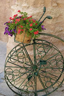 Images Dated 11th January 2023: Cordoba, Spain. Bicycle planter in front of old stone building