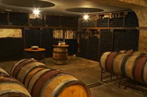 A corner in the cellar where older vintages are stored. Chateau de Beaucastel, Domaines Perrin
