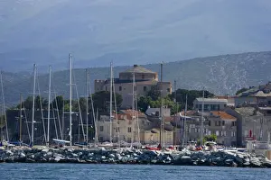 Infrastructure Prints: Corsica. France. Europe. Mast of boats & breakwater below citadel & other buildings of St