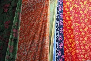 Sari Prints: Costa Rica, Manuel Antonio. Batiks hanging along beach make for colorful souvenirs of Costa Rica