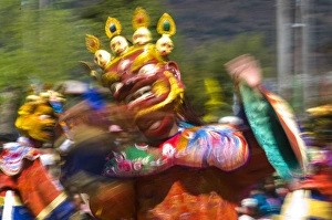 Costumed dancers at religious festivity with many visitors, Paro Tsechu, Bhutan