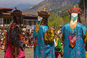 Images Dated 7th April 2009: Costumed dancers at religious festivity with many visitors, Paro Tsechu, Bhutan