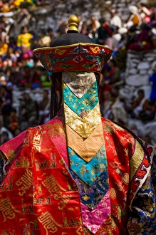 Images Dated 7th April 2009: Costumed dancers at religious festivity with many visitors, Paro Tsechu, Bhutan