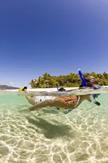 Images Dated 8th September 2006: couple (age 23 and 24) enjoying snorkeling the clear tropical waters of a remote island