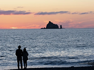 Prints of Couple silhouetted at sunset. Rialto Beach, Olympic Peninsula, Washington State Images Dated 2024 September: Couple silhouetted at sunset. Rialto Beach, Olympic Peninsula, Washington State