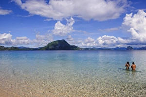 Bacuit Prints: Couple standing in the clear waters of the Bacuit archipelago, Palawan, Philippines