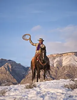 Western Scenic Prints: Cowboy riding a horse on the range on The Hideout Ranch in Shell Wyoming