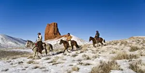 Western Scenic Prints: Cowgirl and cowboy with horses on the range on The Hideout Ranch in Shell Wyoming